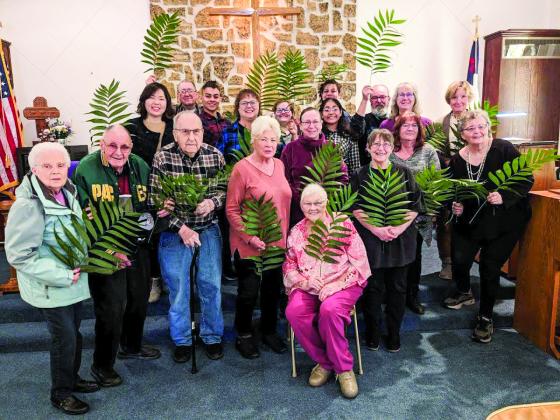 Coloma Calvary United Methodist Church celebrated Palm Sunday on March 24 with the waving of Palm branches. Pictured are: Clarice Babbe, seated; Fern and Wally King, Karl Zimmerman, Carole Reich, Nancy Kopach, Penny Pine, Renee LeFever and Mary Jane Schmudlach; (back): Pastor Hyunmin Lee, Bill Schmudlach, Ronald Ryfkogel, Micki Podoll, Alexis Parker, Catherine and Emma Ryfkogel, Mike and Anita Hoover, and Kelly Pooch. Taking the photo is Carole Johnson.